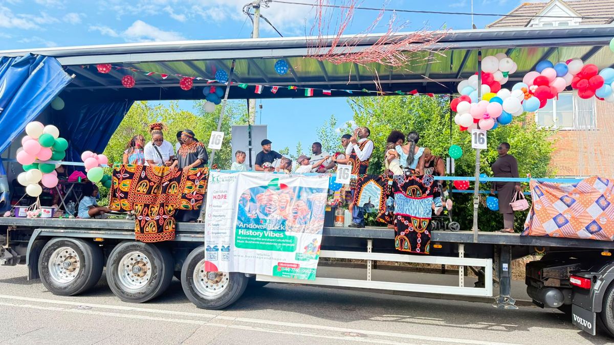 Heritage & Hope carnival float moving through the street
