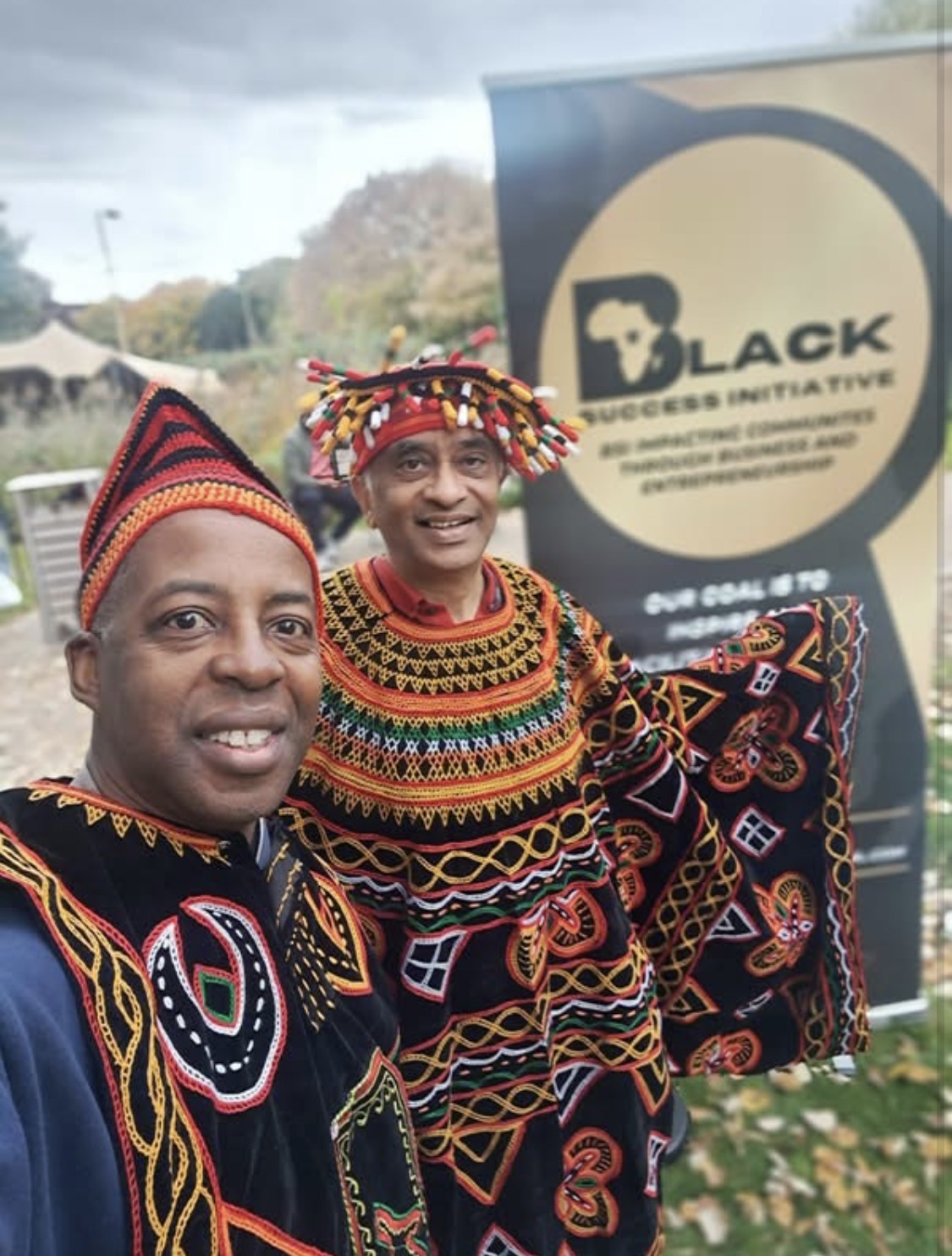 Two attendees in traditional Cameroonian dress at the event